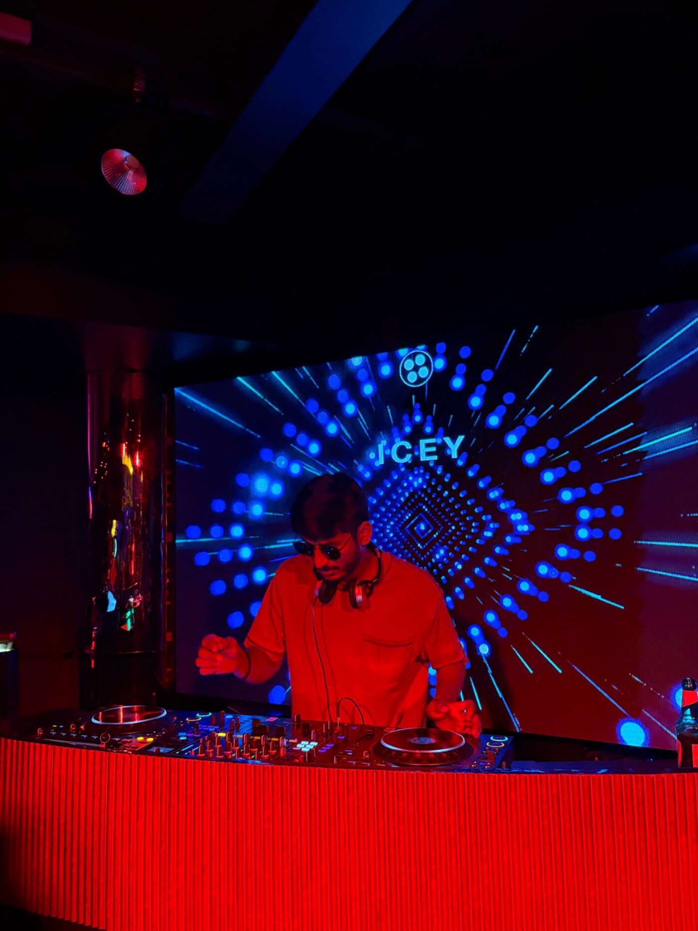 ICEY performing live behind the DJ decks